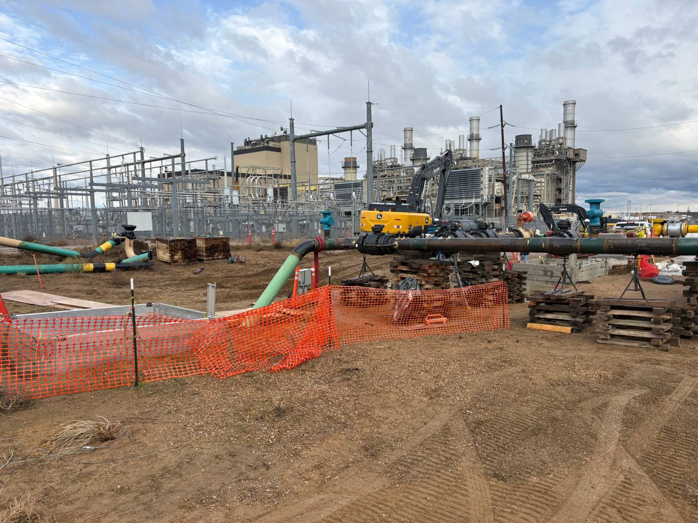 Pipe assembly and excavation beside a power plant and substation